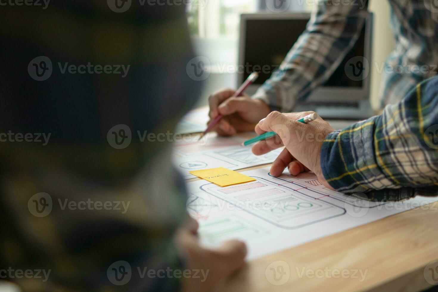 The designer team is designing the uxui system to make the uxui system work well on new phones and support system updates. Website development concept UI UX front end designer photo