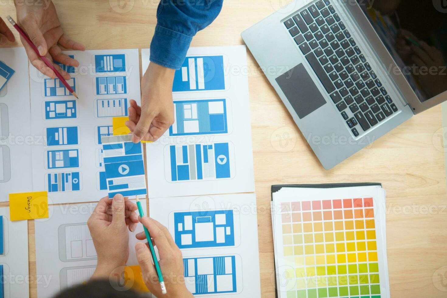 The designer team is designing the uxui system to make the uxui system work well on new phones and support system updates. Website development concept UI UX front end designer photo