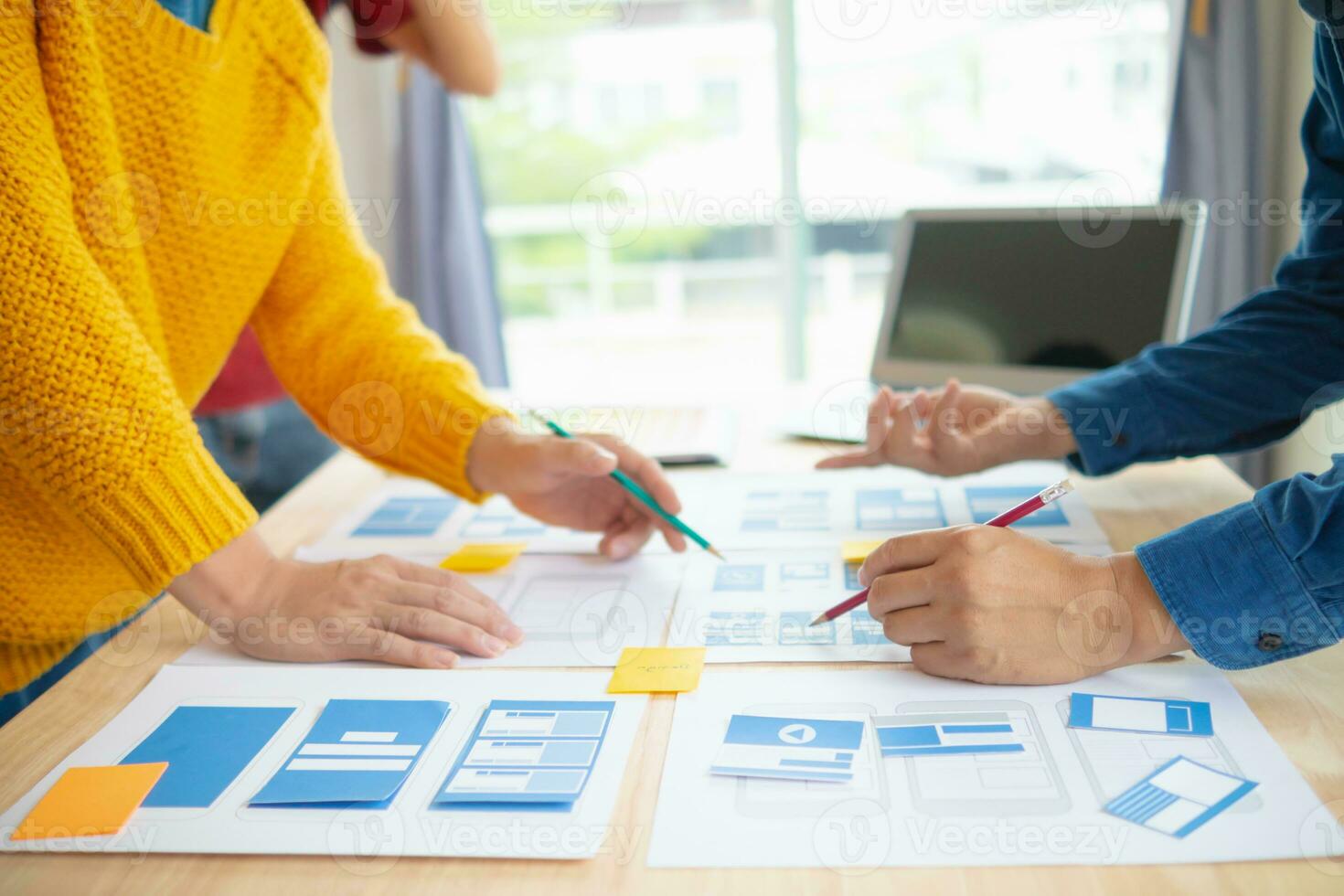 The designer team is designing the uxui system to make the uxui system work well on new phones and support system updates. Website development concept UI UX front end designer photo