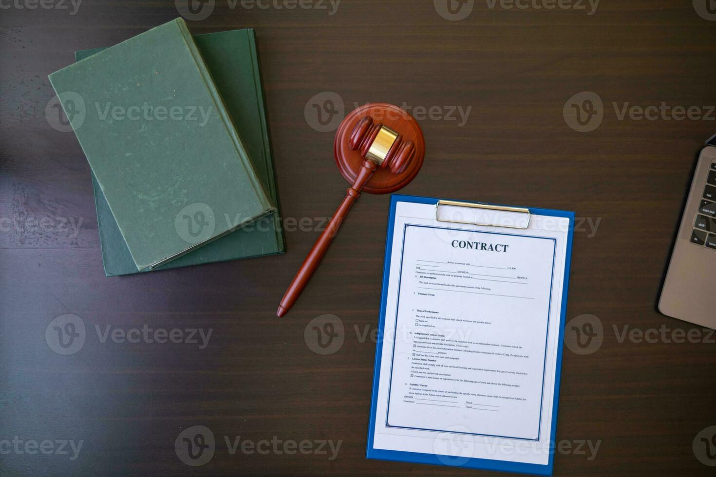 Lawyer holding contract documents in hand and preparing to sign a consulting contract for a team of business people who need legal advice to run their business in accordance with the law photo