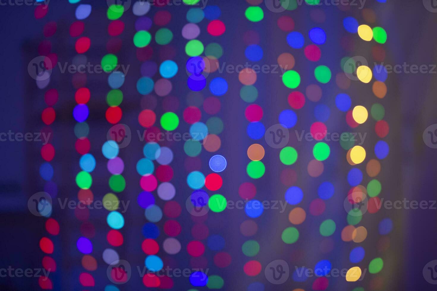 Multicolored bokeh spots on a blue background. Background for the holiday. photo