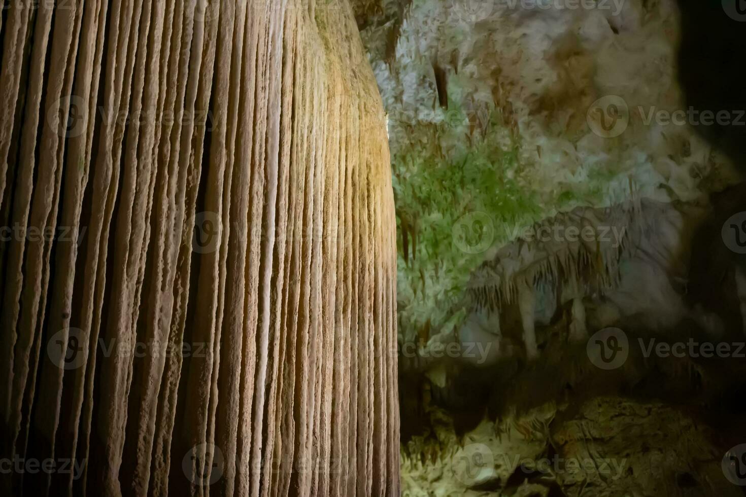 The cave is karst, amazing view of stalactites and stalagnites illuminated by bright light, a beautiful natural attraction in a tourist place. photo