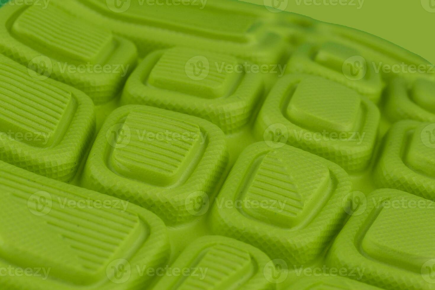 Fragment of a rubber green sole sneaker. Bottom of sports shoes photo