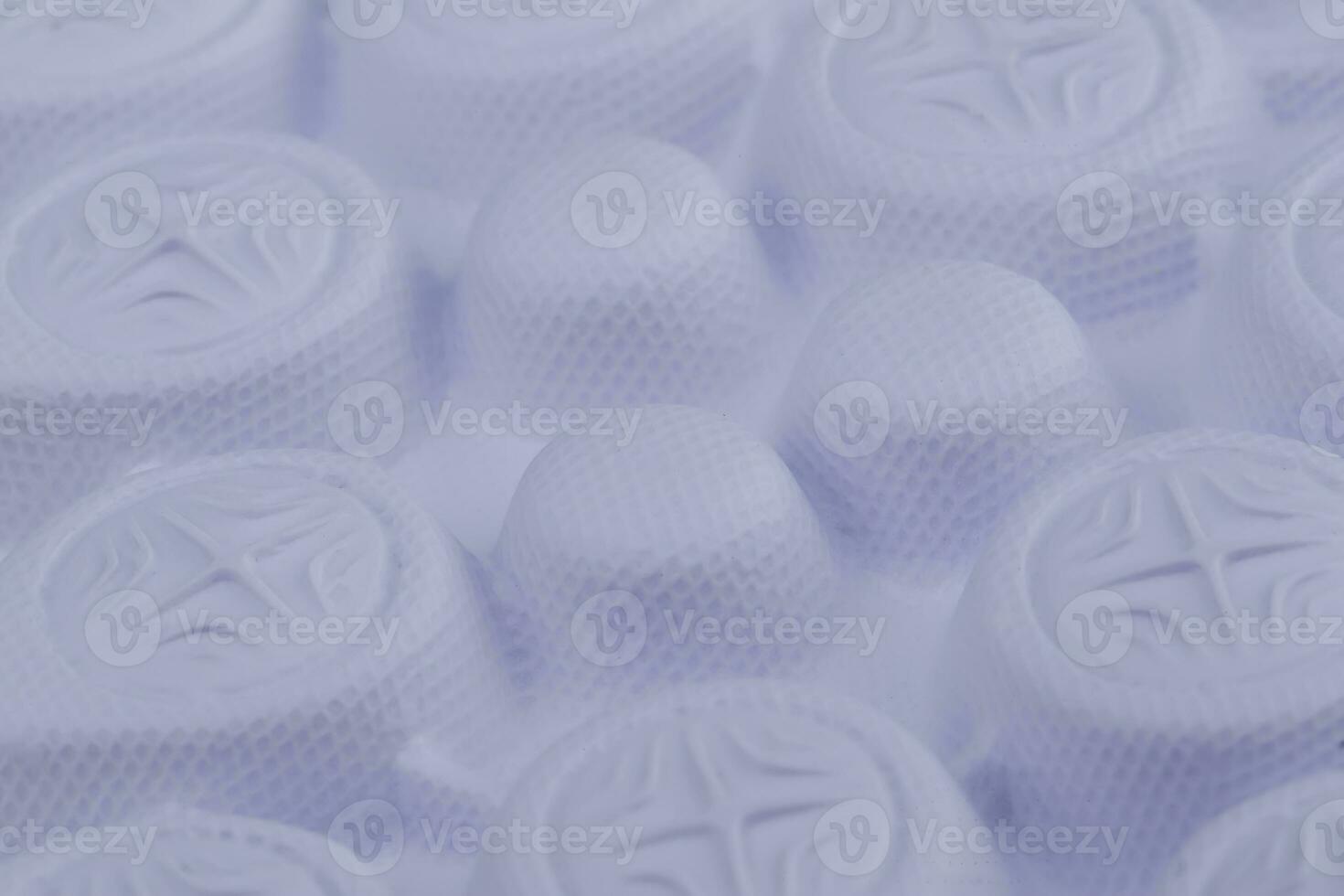 Fragment of a rubber white sole of a sneaker. Bottom of sports shoes photo