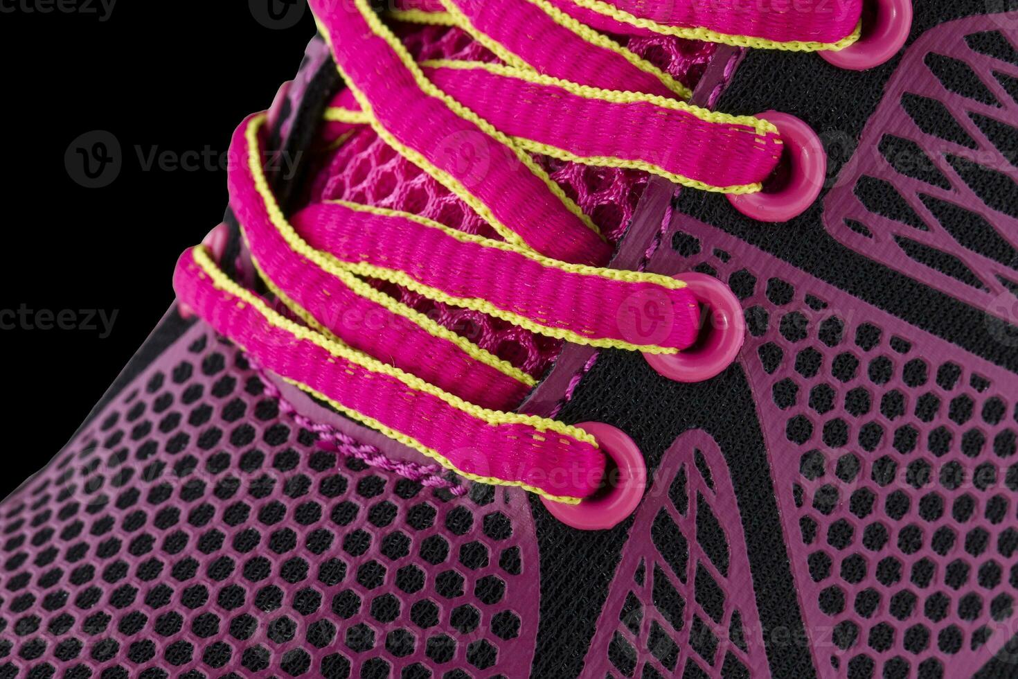 Fragment of red sneakers with laces close up. Sneaker texture photo