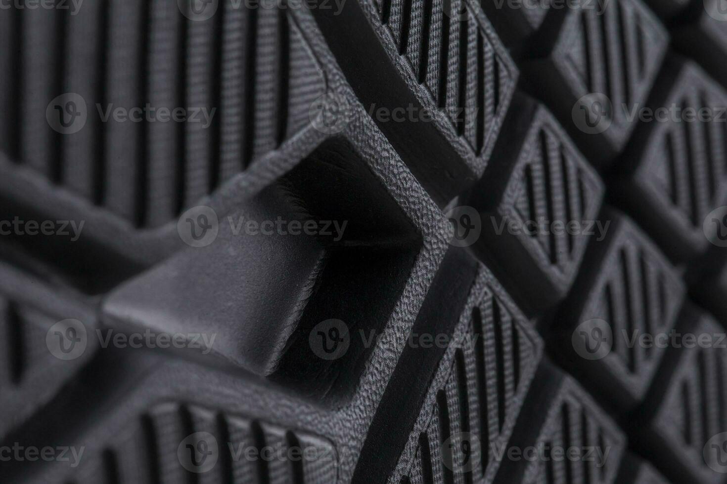Fragment of a rubber black sole sneaker. Bottom of sports shoes photo