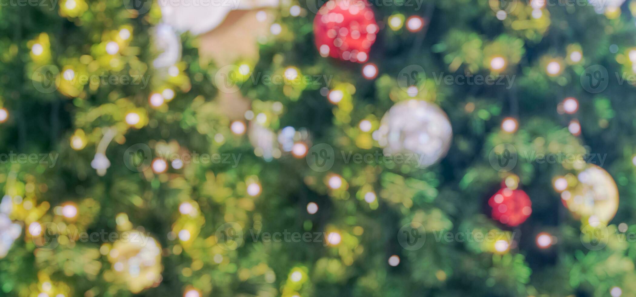 Abstract blurred christmas tree with bokeh light background photo