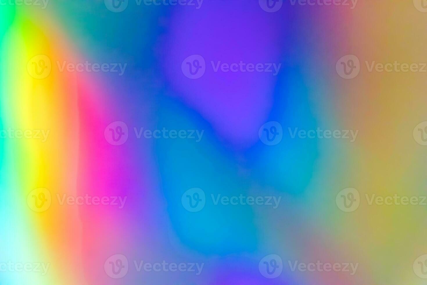 Abstract blur holographic rainbow foil iridescent background photo