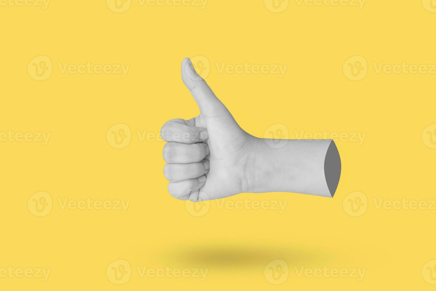 Woman hand gesture thumb up sign isolated on yellow background photo