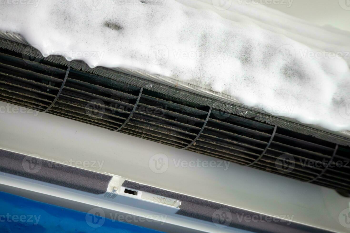 air conditioner cleaning with spray foam cleaner photo