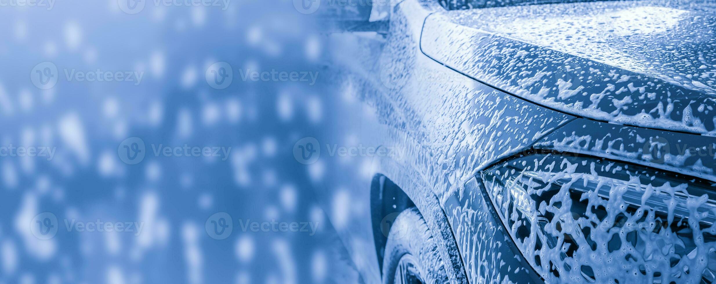 car cleaning and washing with foam soap background photo