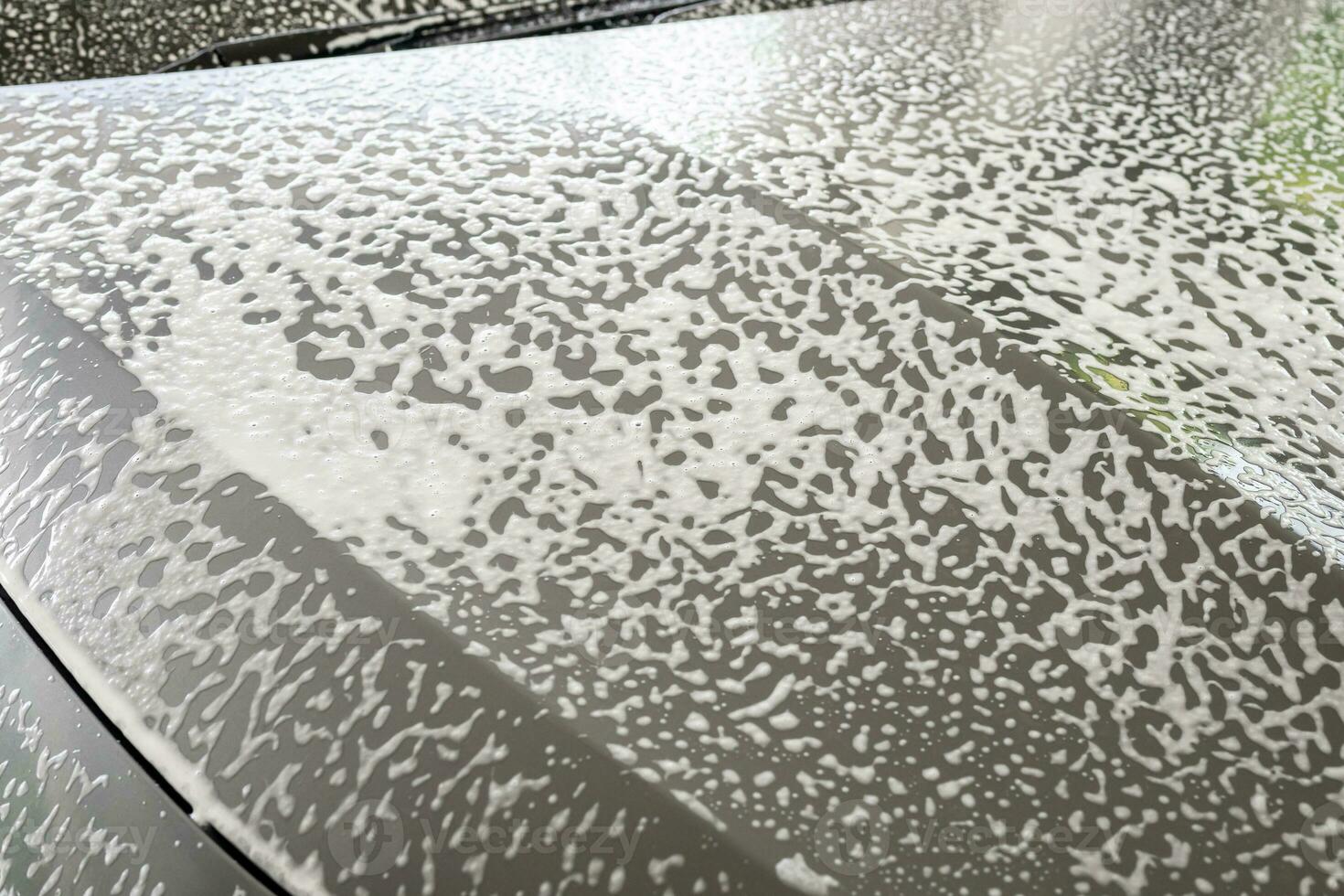 car cleaning and washing with foam soap photo