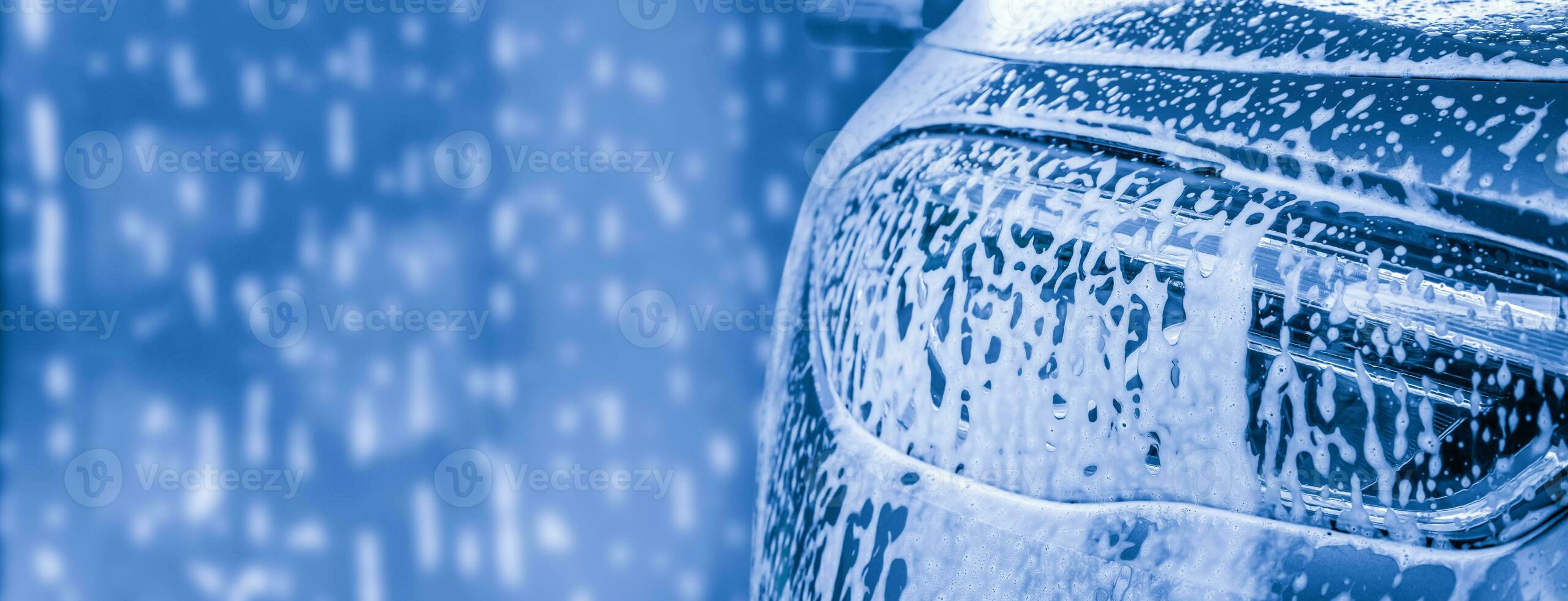 car cleaning and washing with foam soap background photo