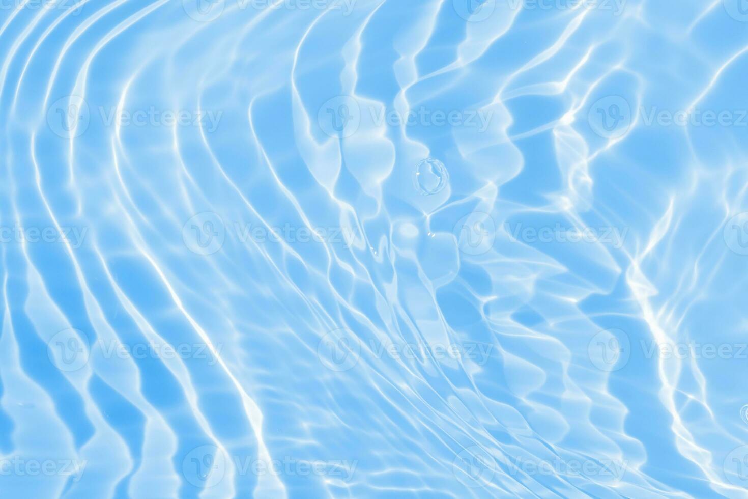 Abstract transparent water shadow surface texture natural ripple on blue background photo