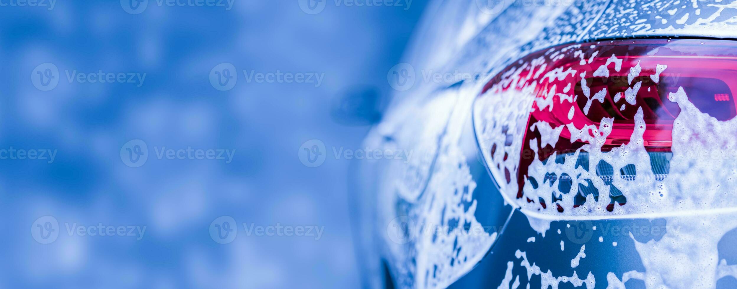 car cleaning and washing with foam soap background photo