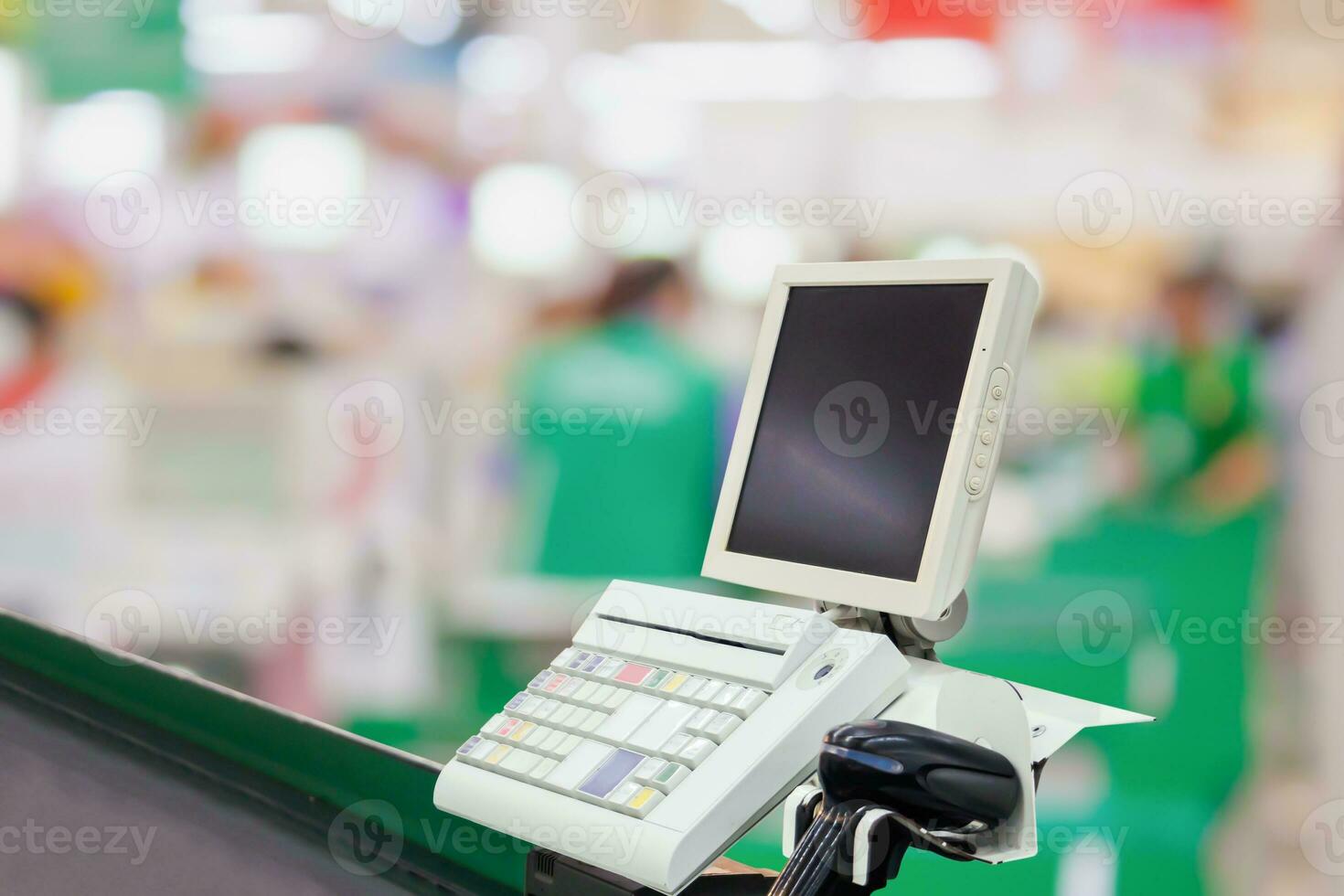 Empty cashier checkout desk with terminal in supermarket photo