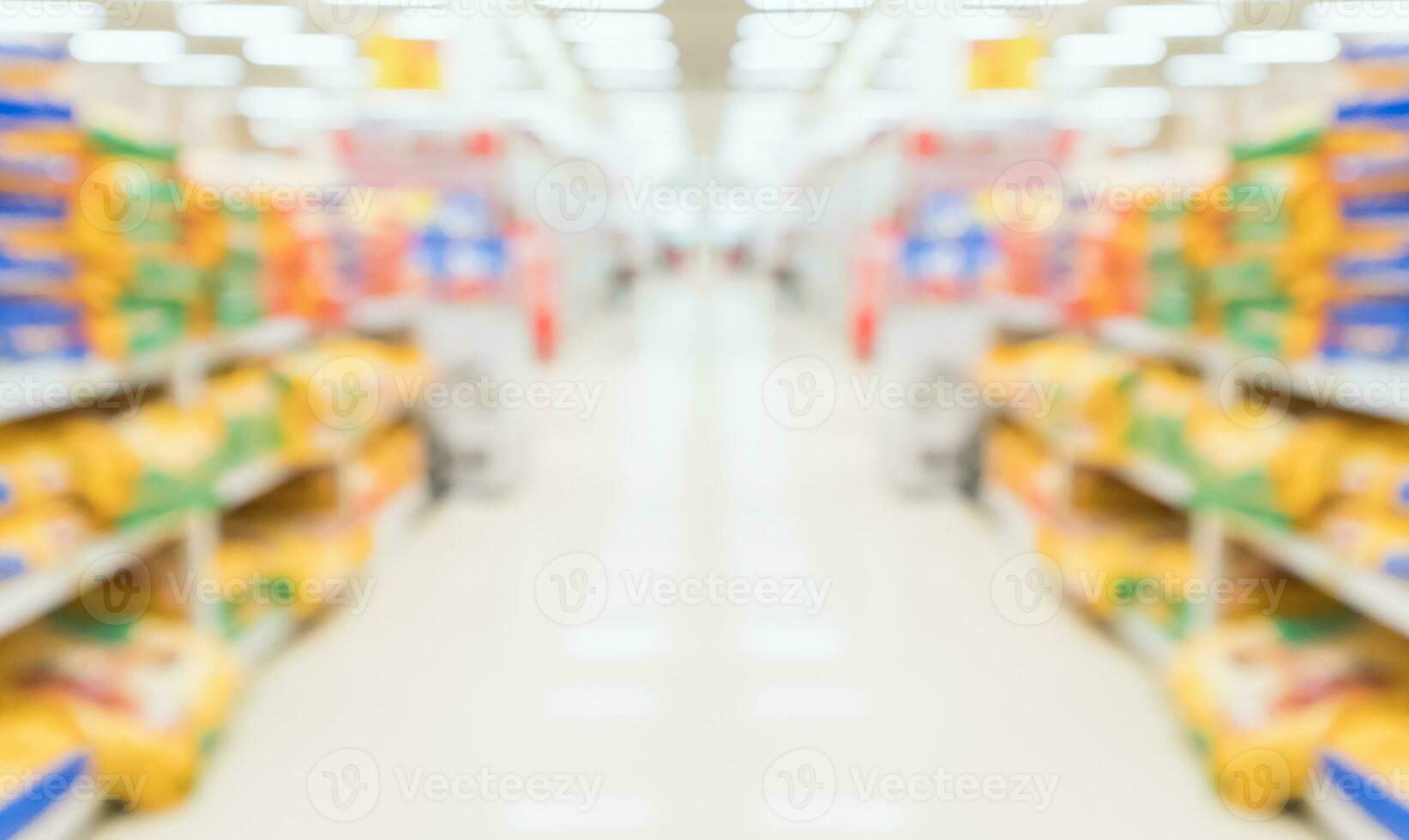 Abstract blur supermarket discount store aisle and product shelves interior defocused background photo