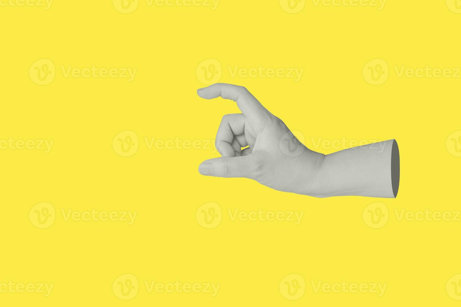 Woman hand gesture holding something isolated on yellow background photo