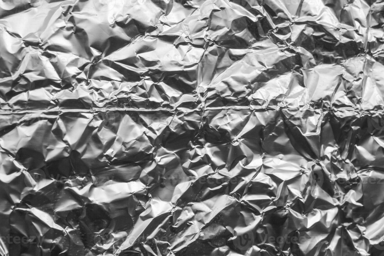 Shiny metal silver gray foil crumpled texture background photo