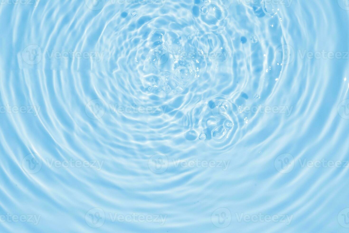 Abstract transparent water shadow surface texture natural ripple on blue background photo