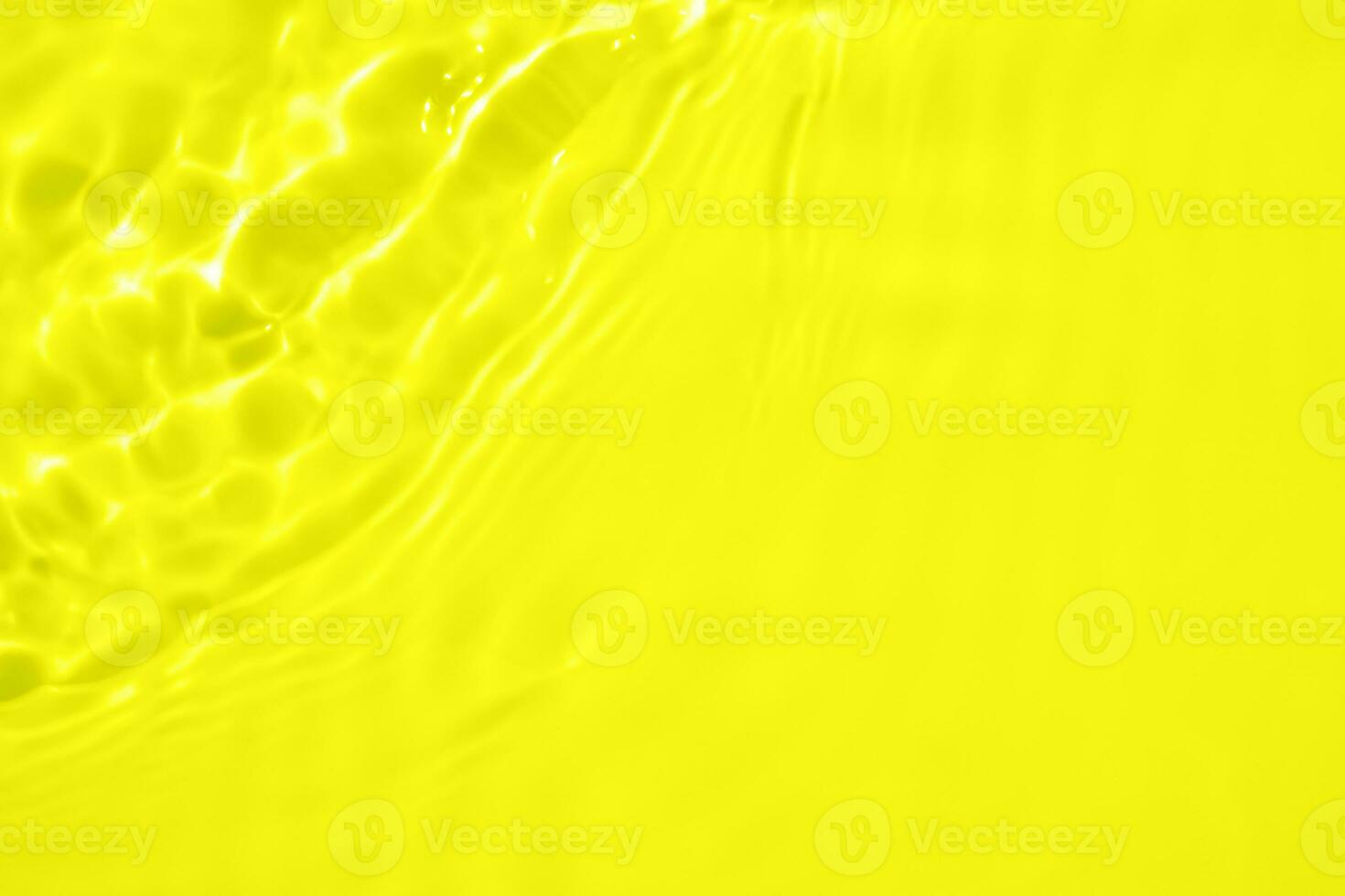 Abstract transparent water shadow surface texture natural ripple on yellow background photo
