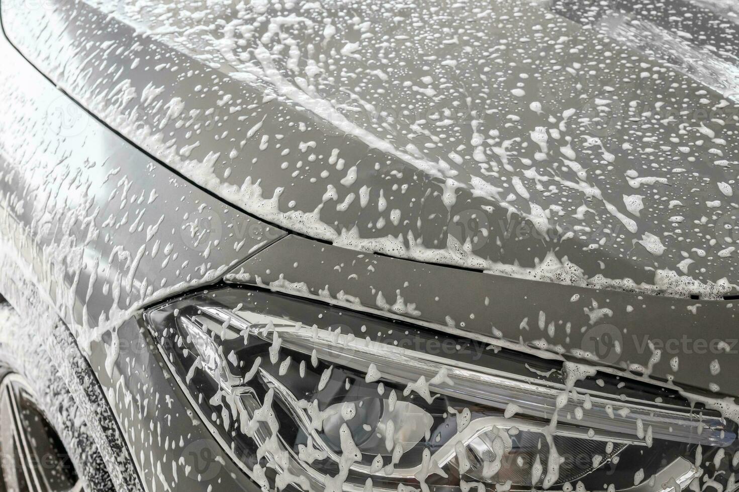 car cleaning and washing with foam soap photo