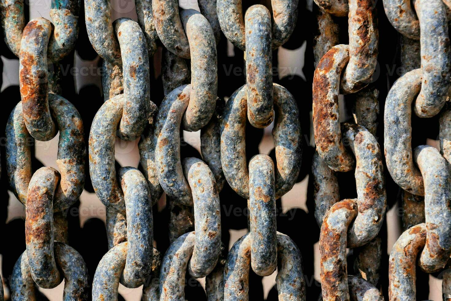 a close up of a chain of rusty links photo