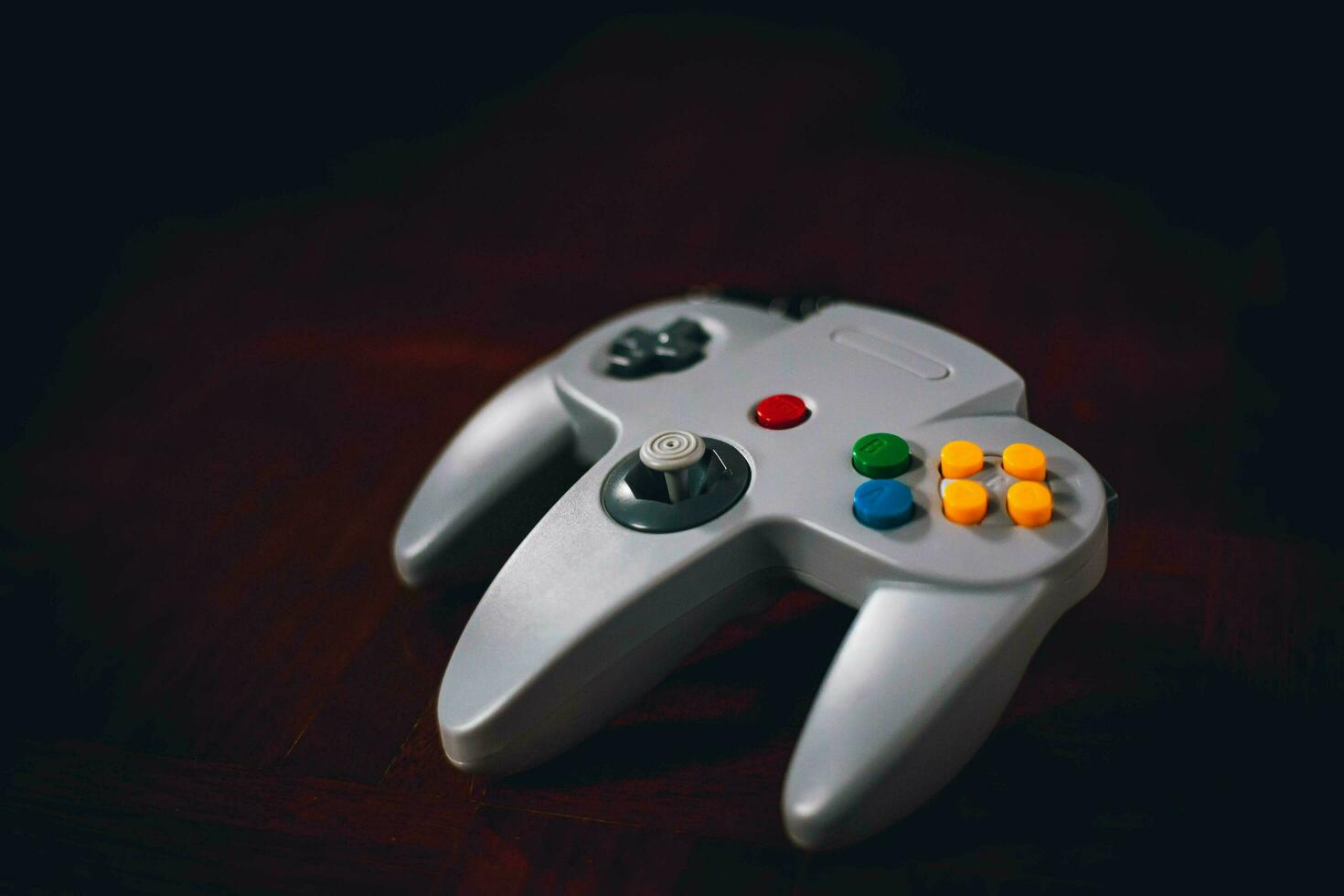 video game controller on a dark background. retro style toned picture. photo