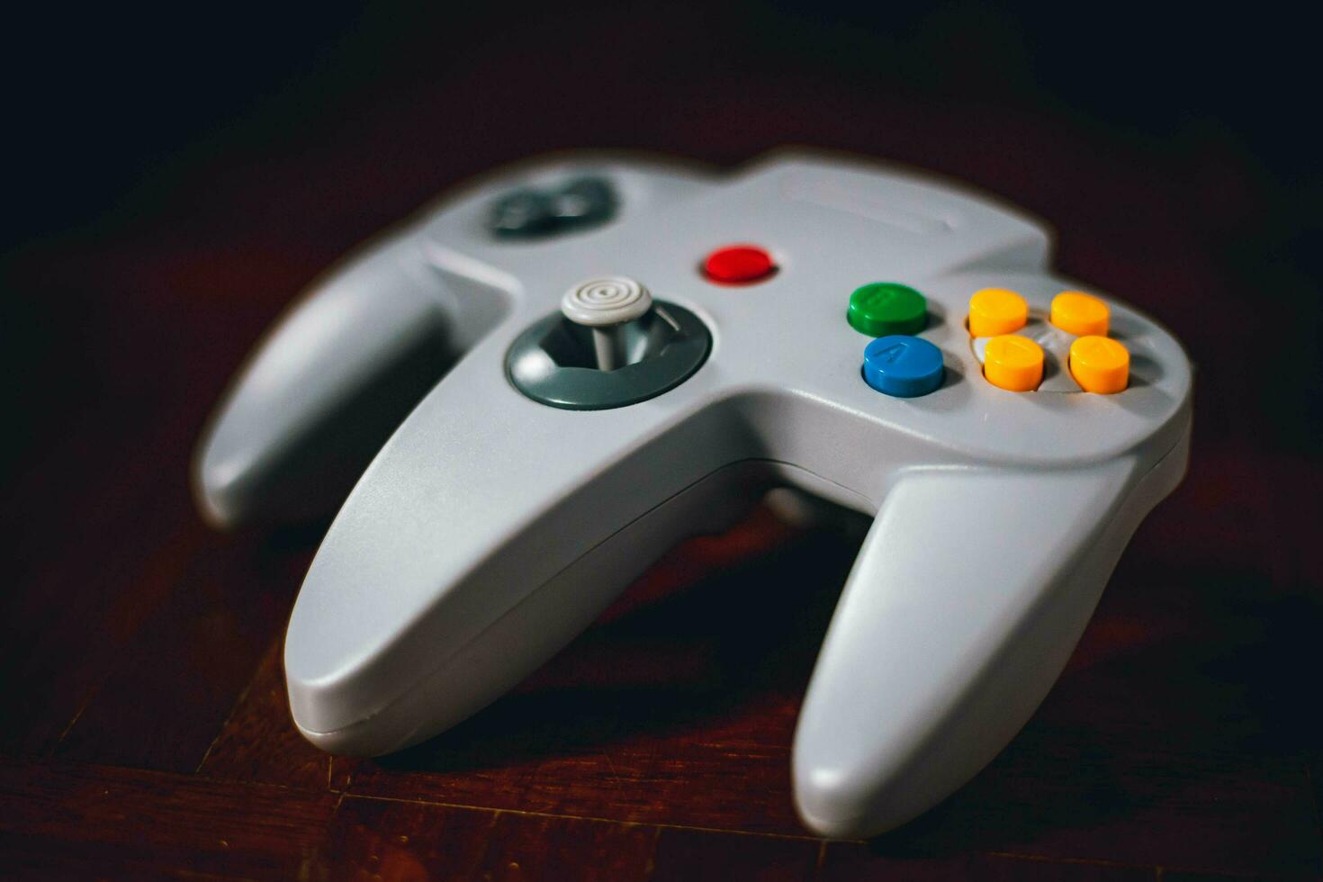 video game controller on a dark background. retro style toned picture. photo