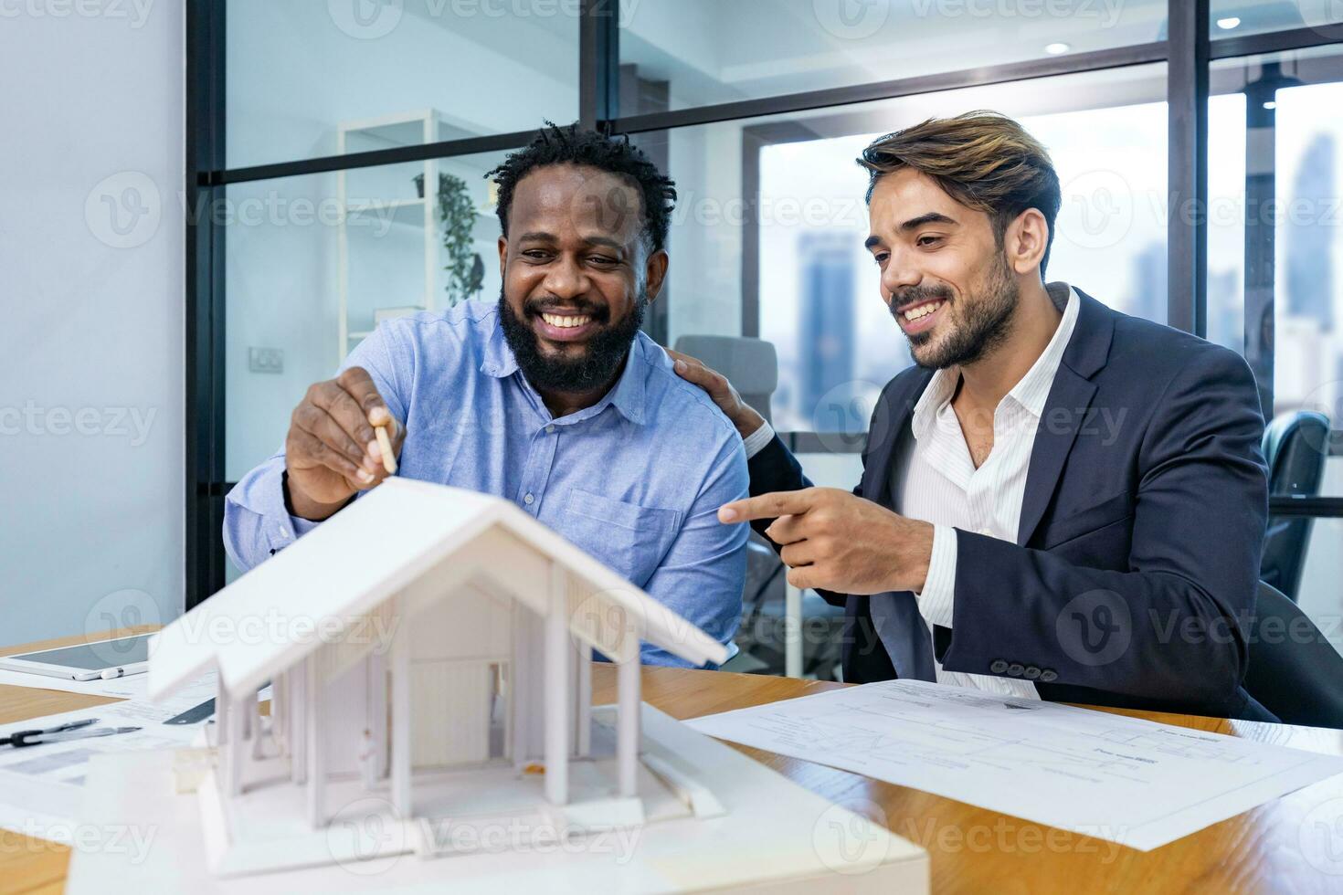 Team of architecture and businessman are discussing and brainstorming on floor plan modification for real estate investment and housing development project photo