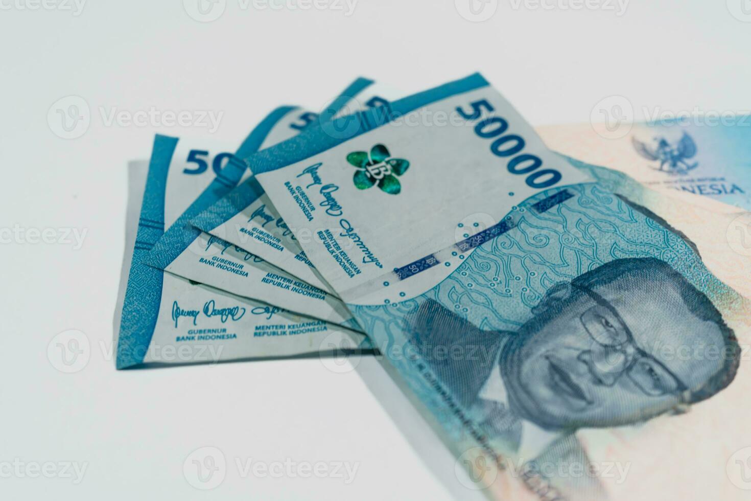 Indonesian banknote 50000 rupiah. Total sum 200000 rupiah. Copy space. Finance, business and economics topics concept. photo