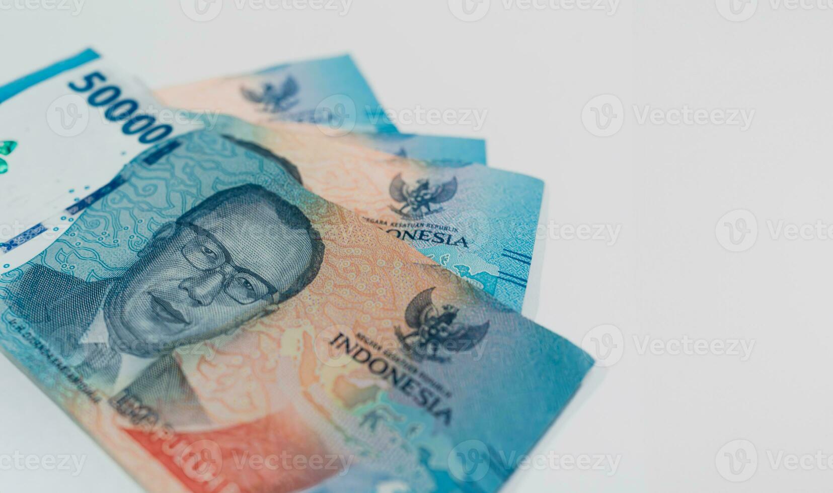 Indonesian banknote 50000 rupiah. Total sum 200000 rupiah. Copy space. Finance, business and economics topics concept. photo