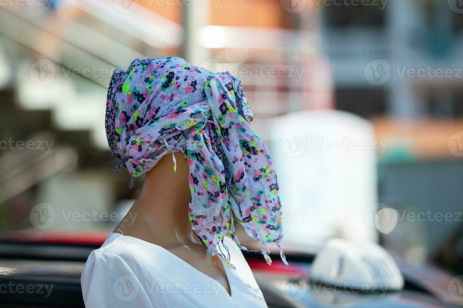 A colorful shawl turban on the mannequin's head. photo