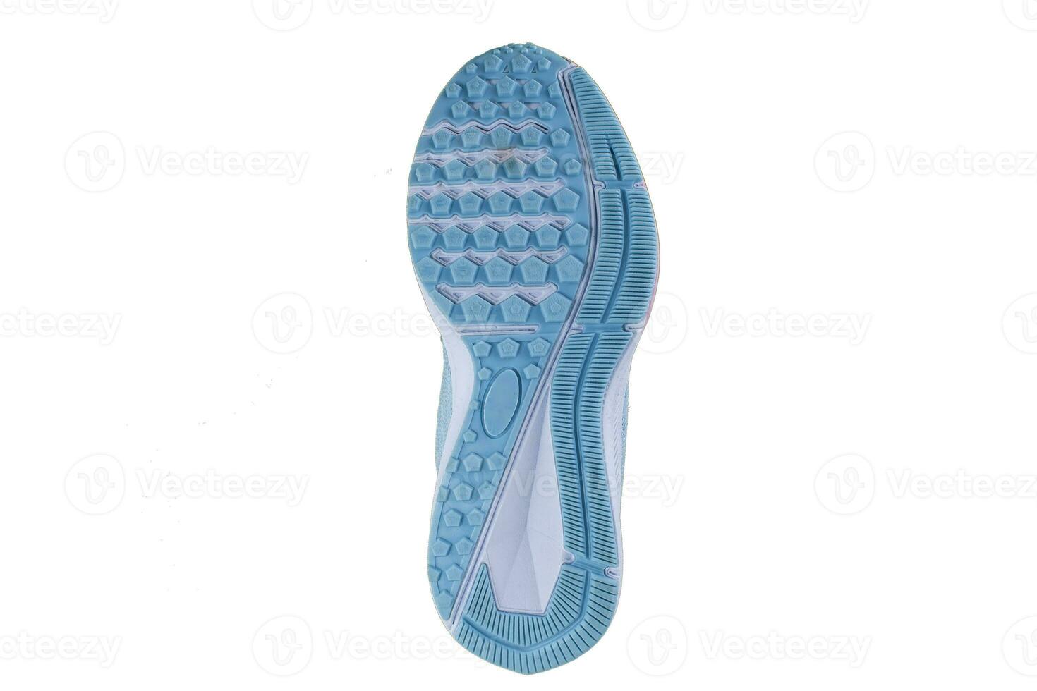 Blue rubber sole with sneakers on a white background. photo