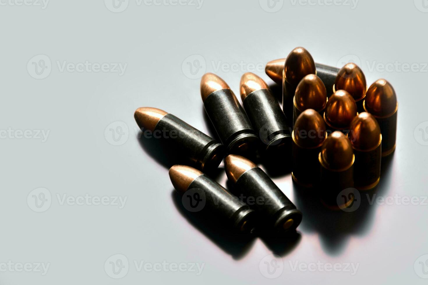 9mm pistol gun bullets on dark leather background, soft focus, new edited, concept for shooting sports and training to protect human life and property around the world. photo