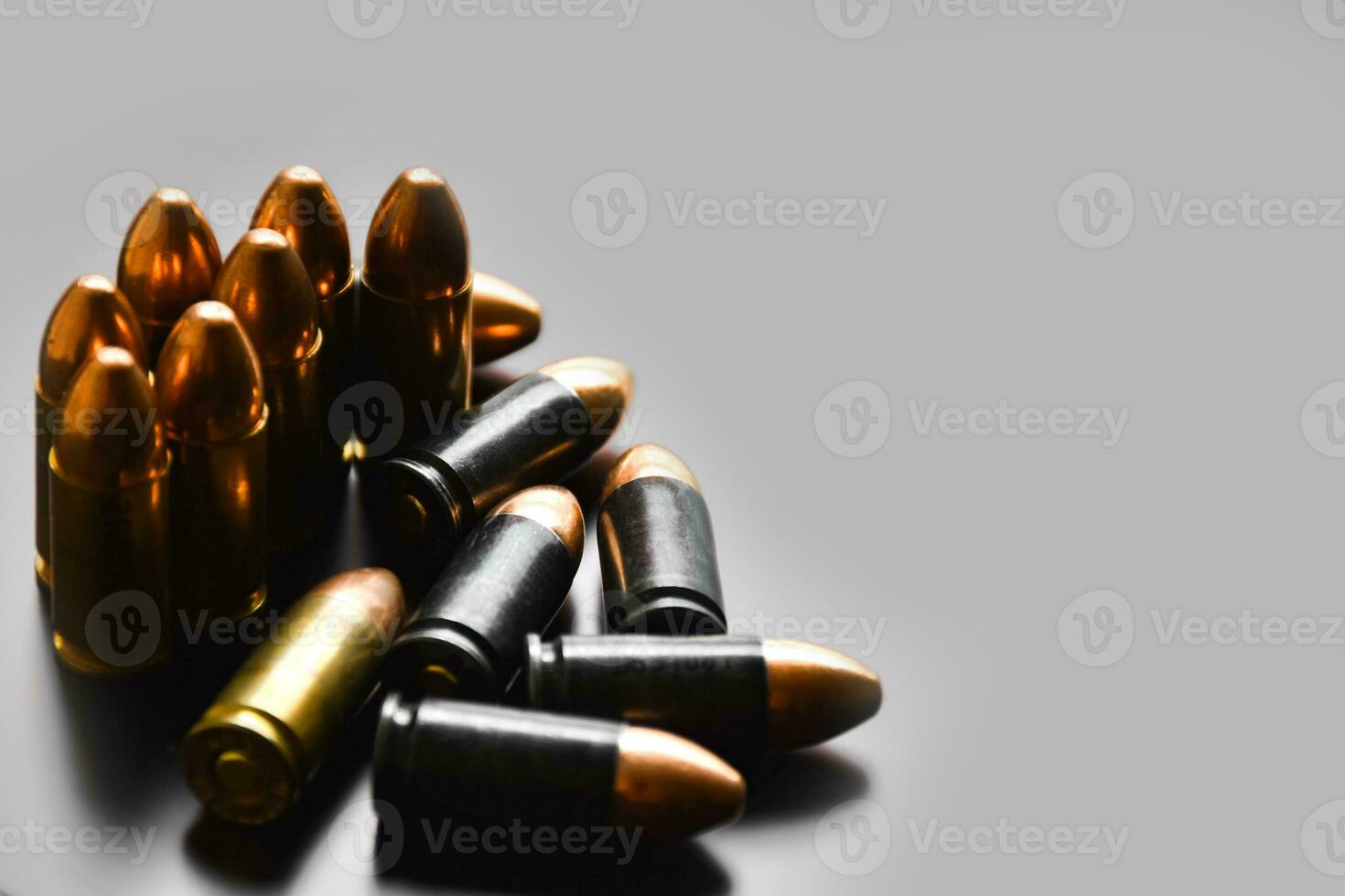 9mm pistol gun bullets on dark leather background, soft focus, new edited, concept for shooting sports and training to protect human life and property around the world. photo