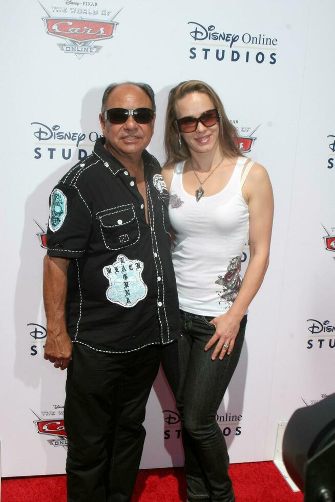 LOS ANGELES  AUG 11 Cheech Marin  Natasha Rubin arrives to DisneyPixar Celebrates The Launch Of The World Of Cars Online at Bobs Big Boy on August 11 2010 in Burbank CA photo