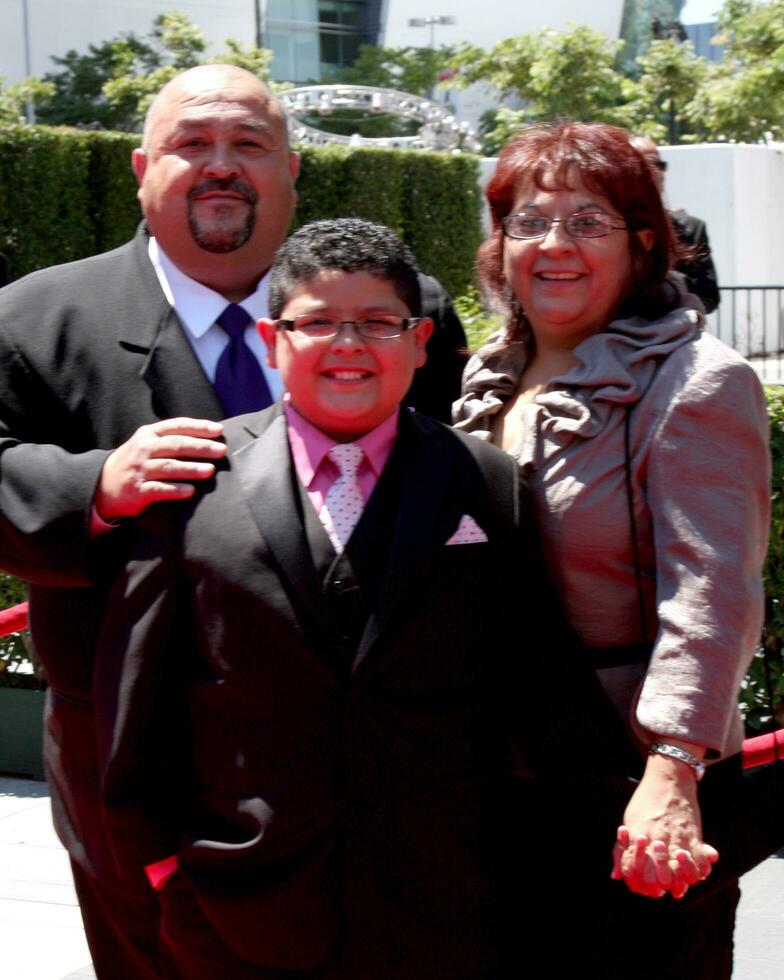 LOS ANGELES  AUG 21 Rico Rodriguez  parents arrives at the 2010 Creative Primetime Emmy Awards at Nokia Theater at LA Live on August 21 2010 in Los Angeles CA photo