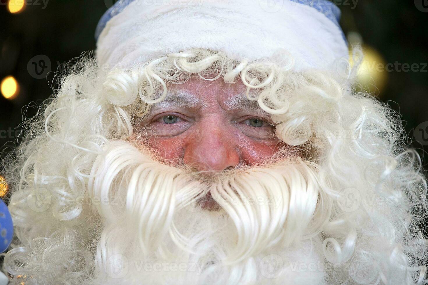 The face of the Russian Santa Claus in a hat with a beard. photo