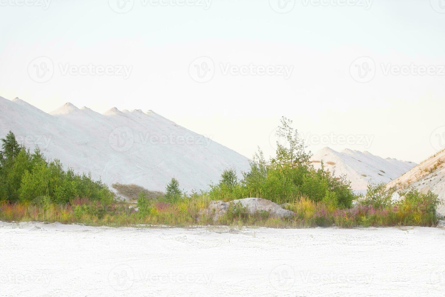 Beautiful landscape of white mountains and sand. Unusual natural landscape. Waste from old chemical production. photo