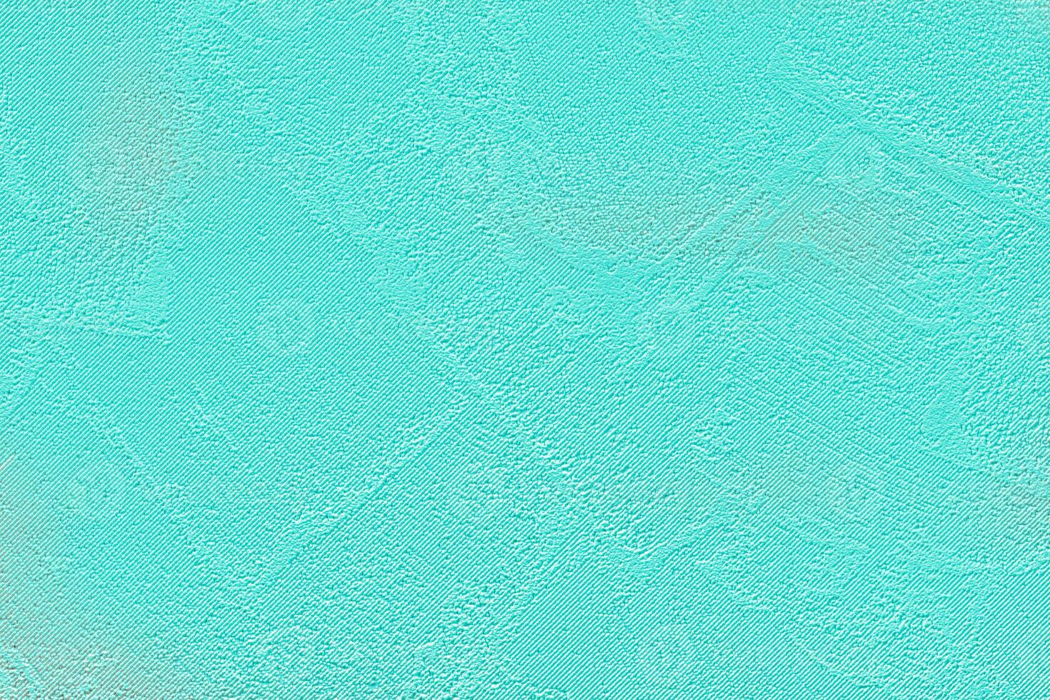 Bright paper embossed turquoise background. photo