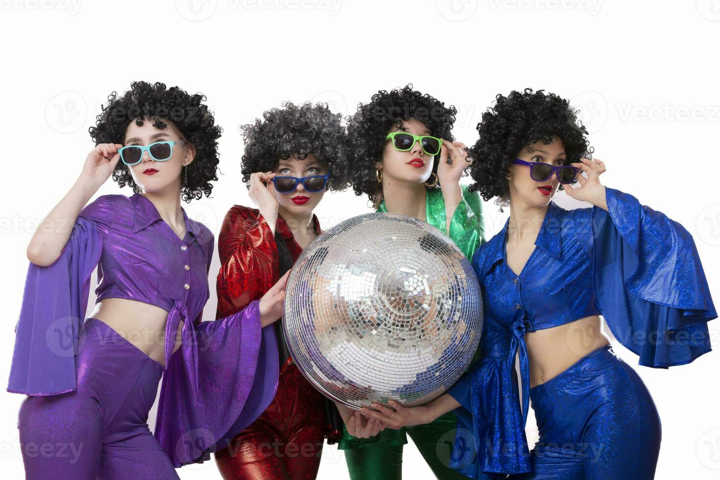 Group of funny girls in disco style, with disco ball, halloween party, on white background. photo