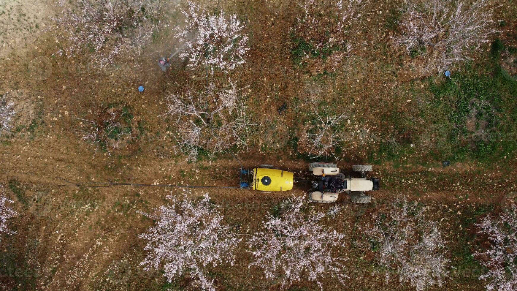 agricultural spraying tractor drone shot photo