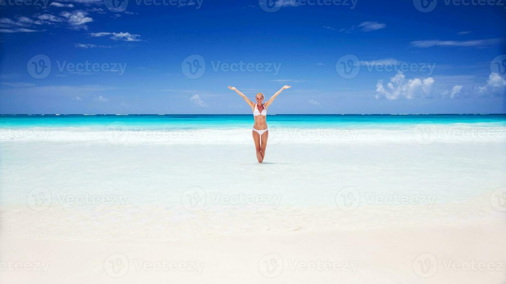 Happy woman on the beach photo