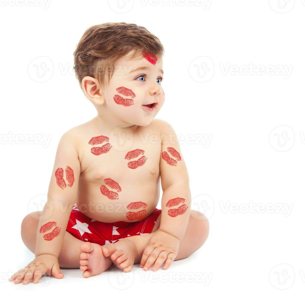 Baby boy with kiss photo