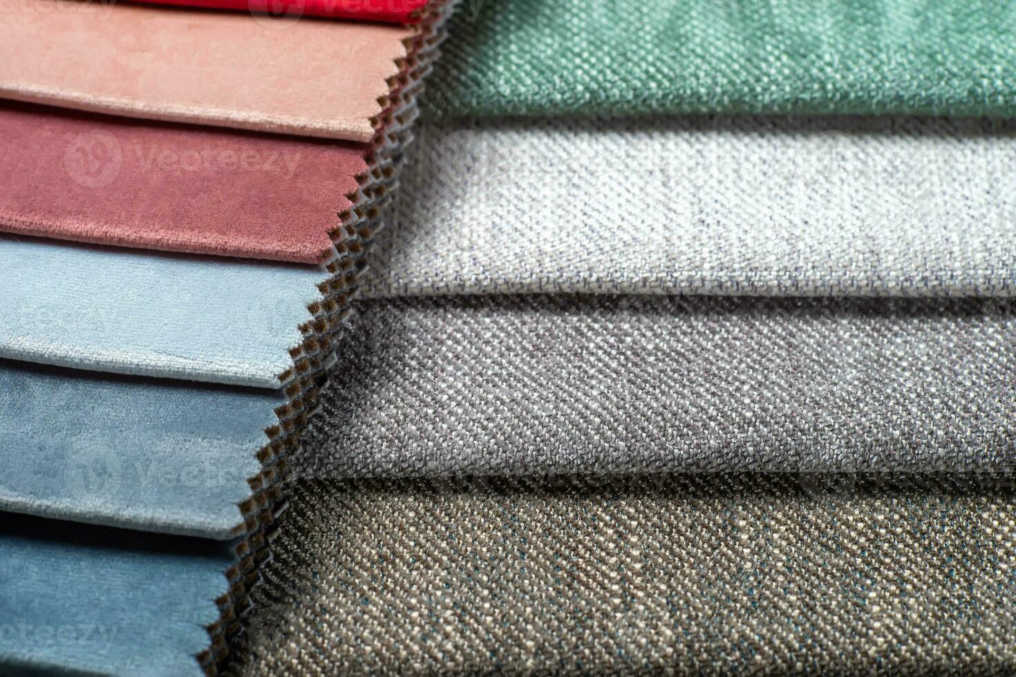 Multi colored set of upholstery fabric samples for selection, collection of textile swatches photo