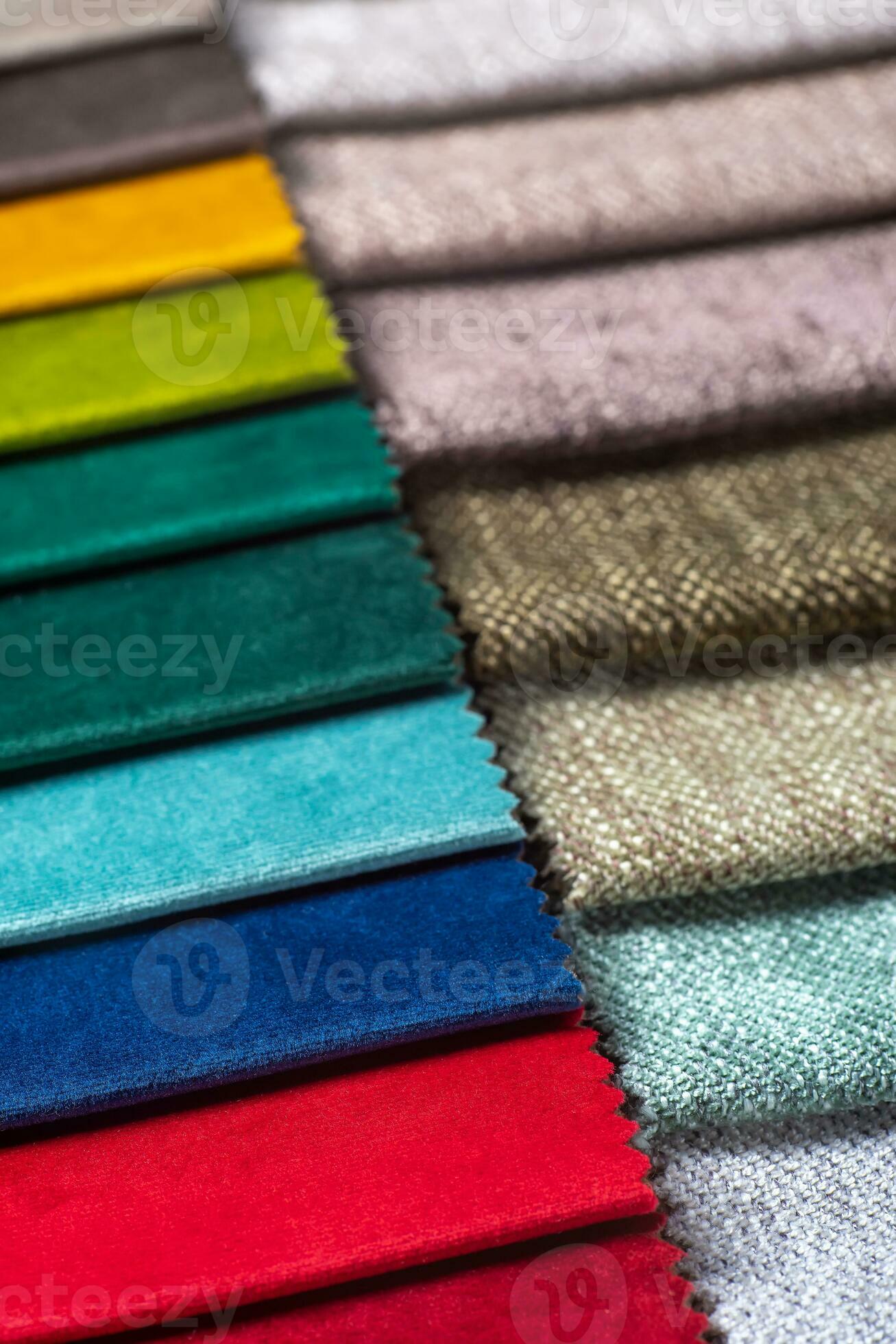 Multi colored set of upholstery fabric samples for selection, collection of textile swatches
