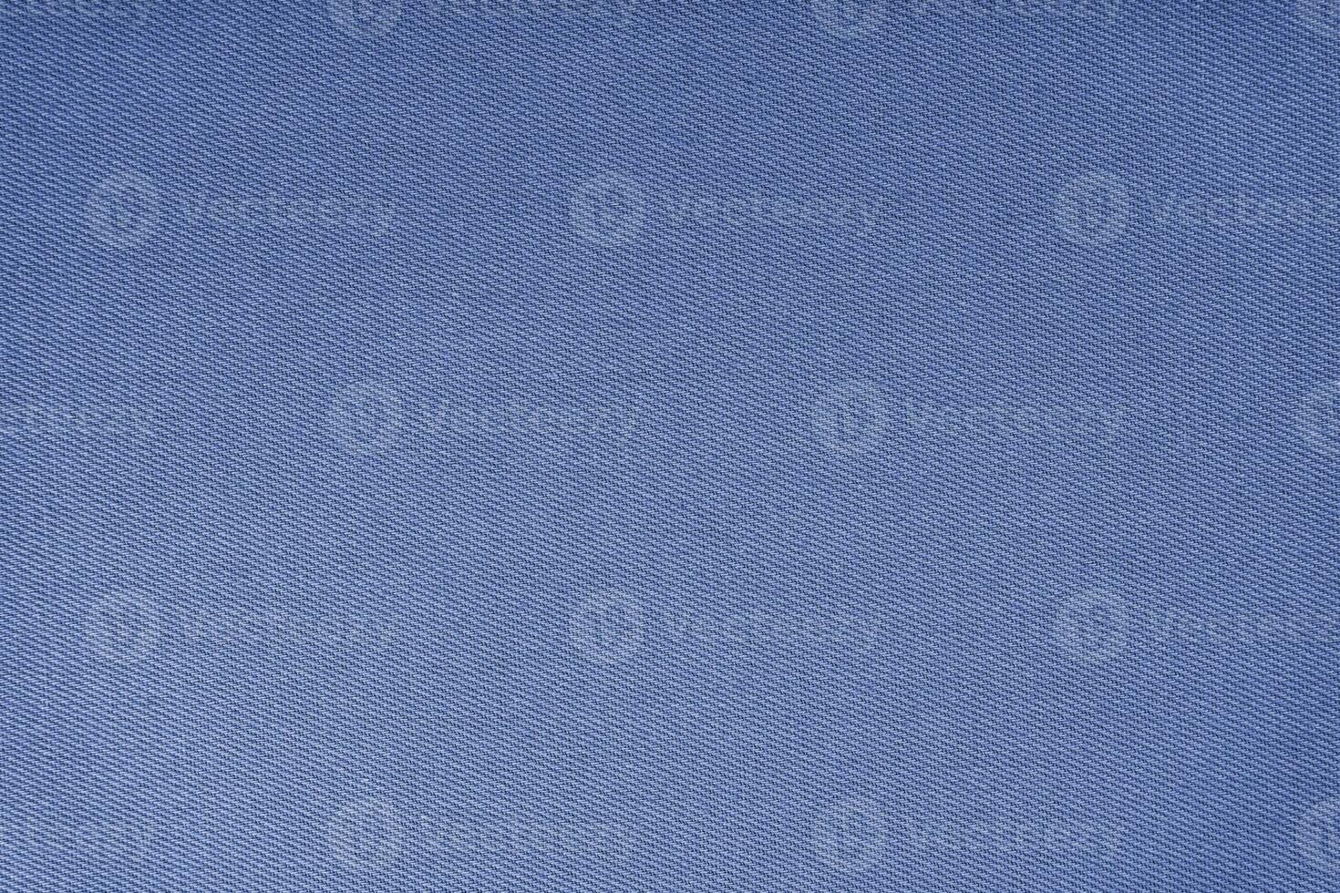 Texture of blue fabric diagonal weave pattern. Decorative textile background photo