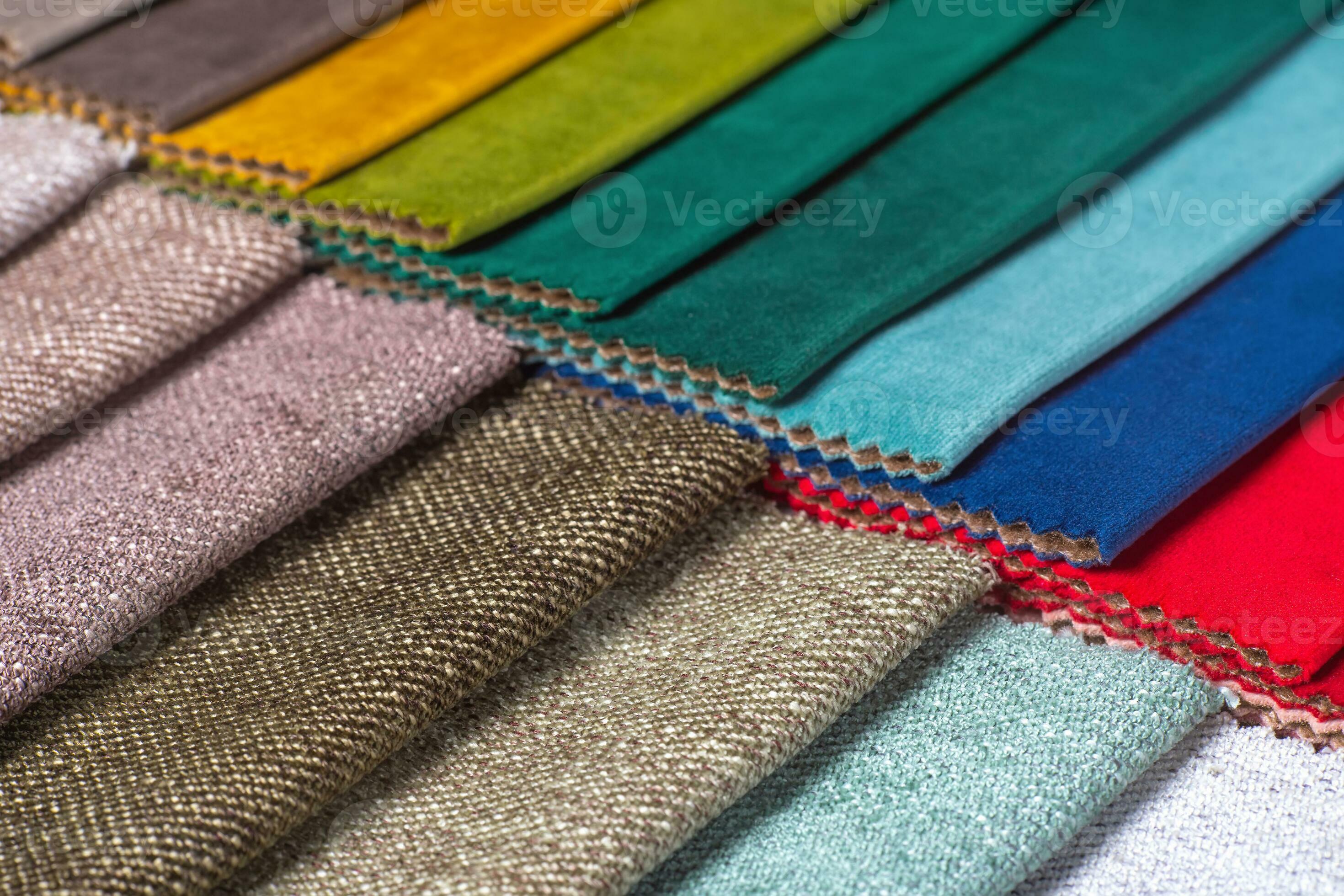 Multi colored set of upholstery fabric samples for selection, collection of textile swatches