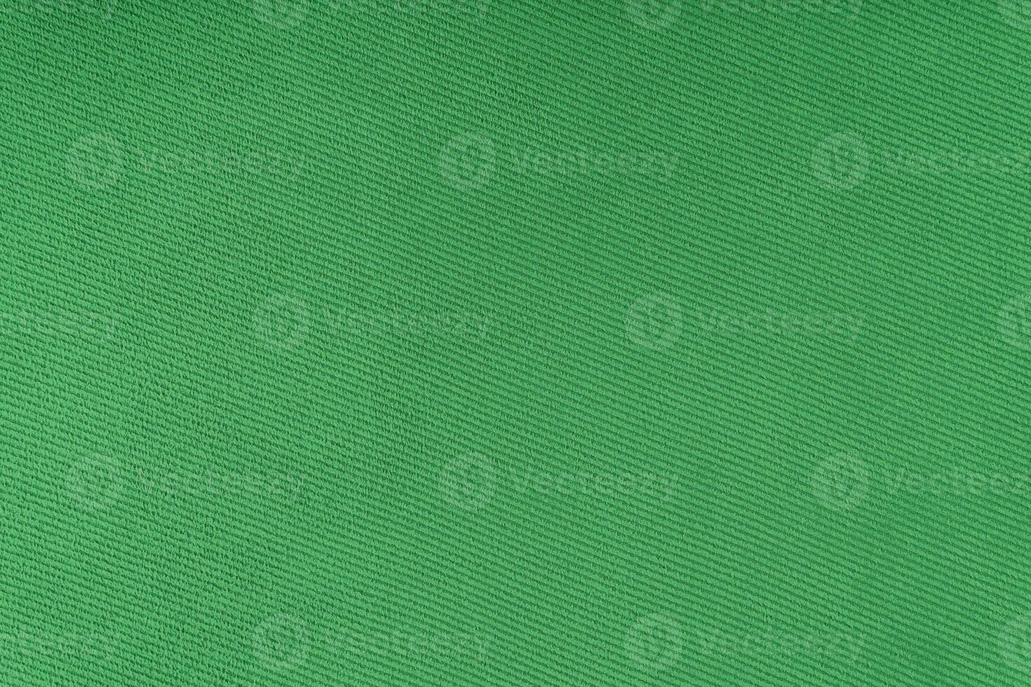 Texture of green fabric diagonal weave pattern. Decorative textile background photo